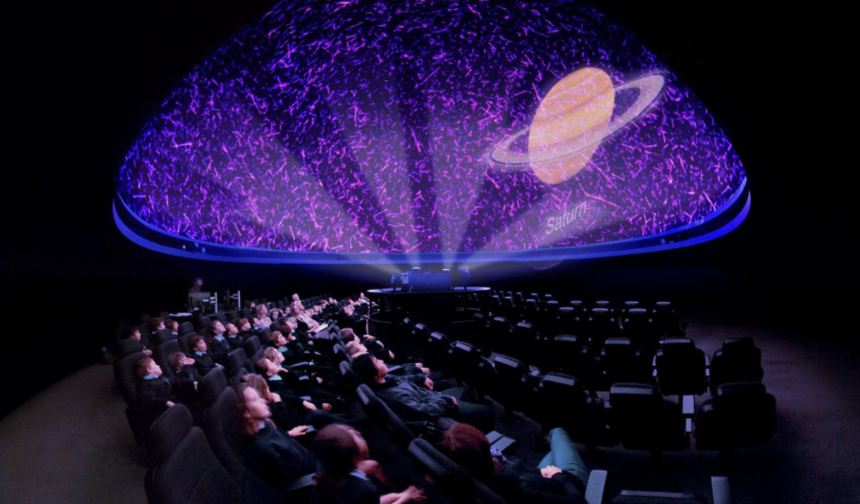 People attend a show at the Peter Harrison Planetarium in Greenwich